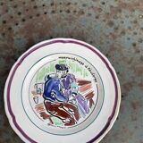 Collectible plate painted by Henry Simon, market gardening at the inn, in enameled ceramic,