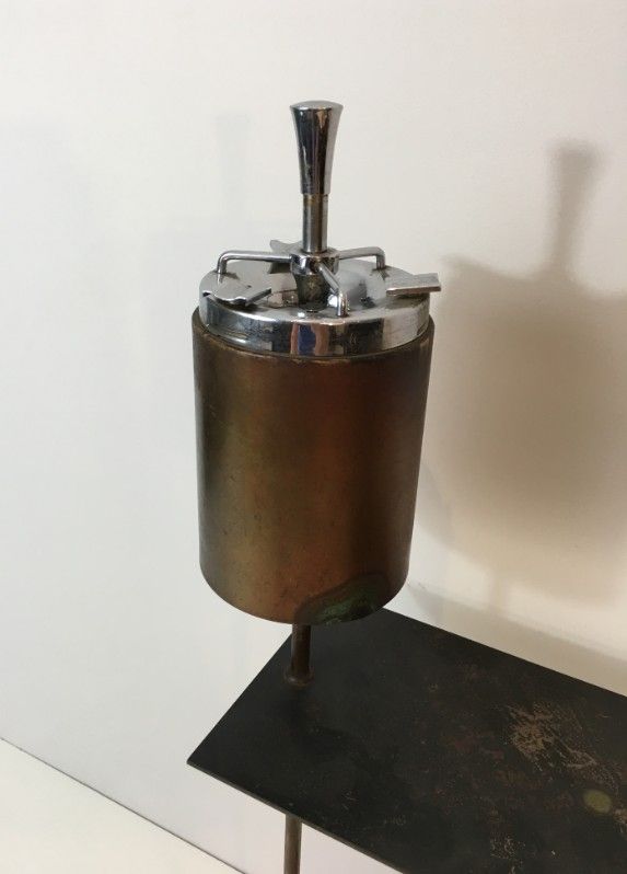 Modernist ashtray in black lacquered metal and brass