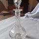 Cut crystal oil bottle with its crystal stopper.