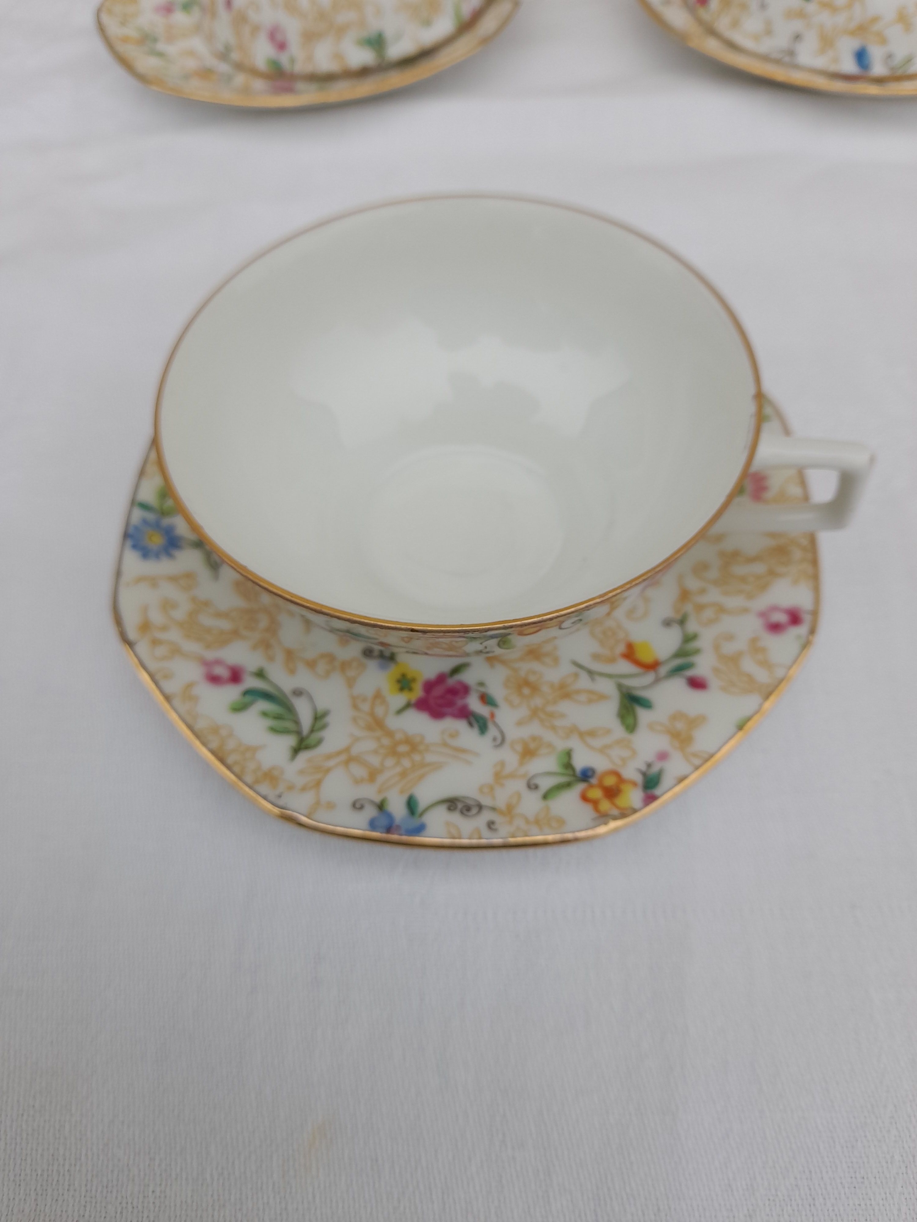 Lourioux Foecy porcelain tea set 12 cups, a sugar bowl and a crèmier