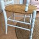 Fauteuil blanc assise paillée