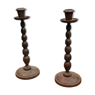 2 cast iron candlesticks