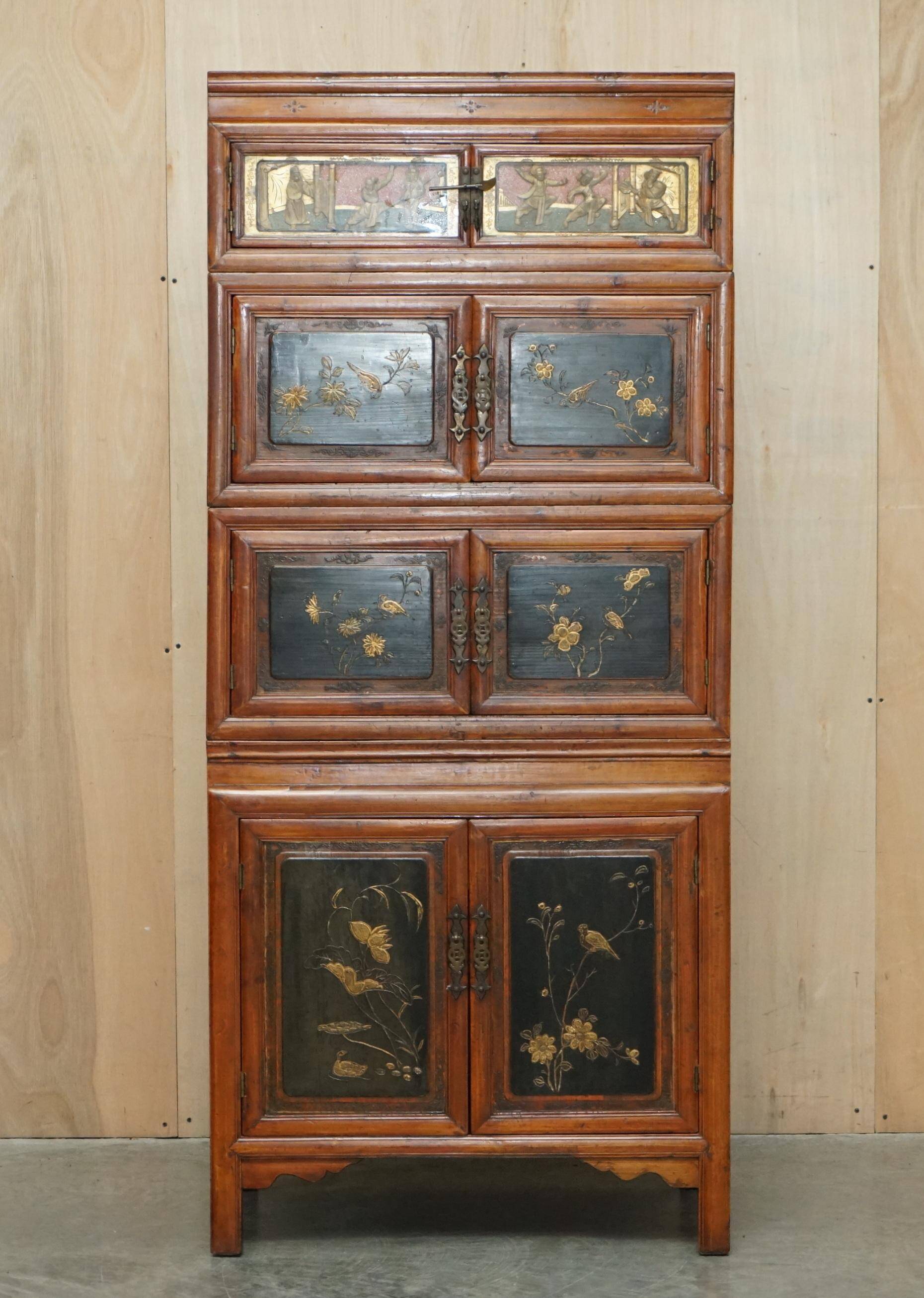 Antique Chinese armoire hand-carved around 1880 with country-style handles.