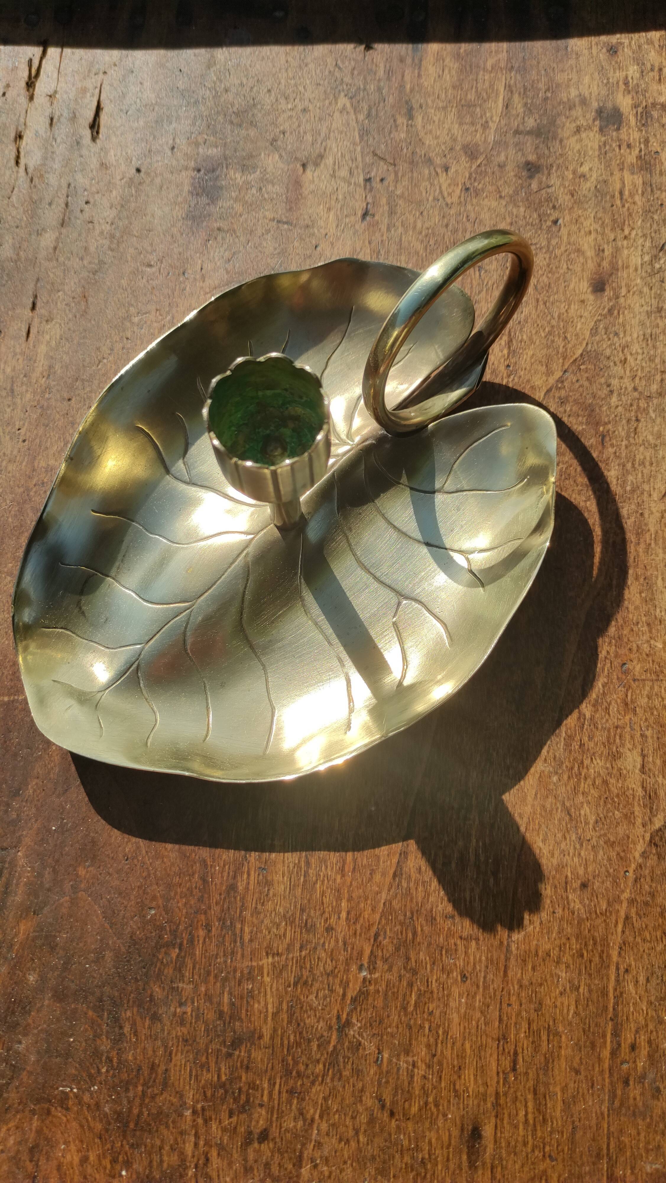 Vintage candle holder in golden brass