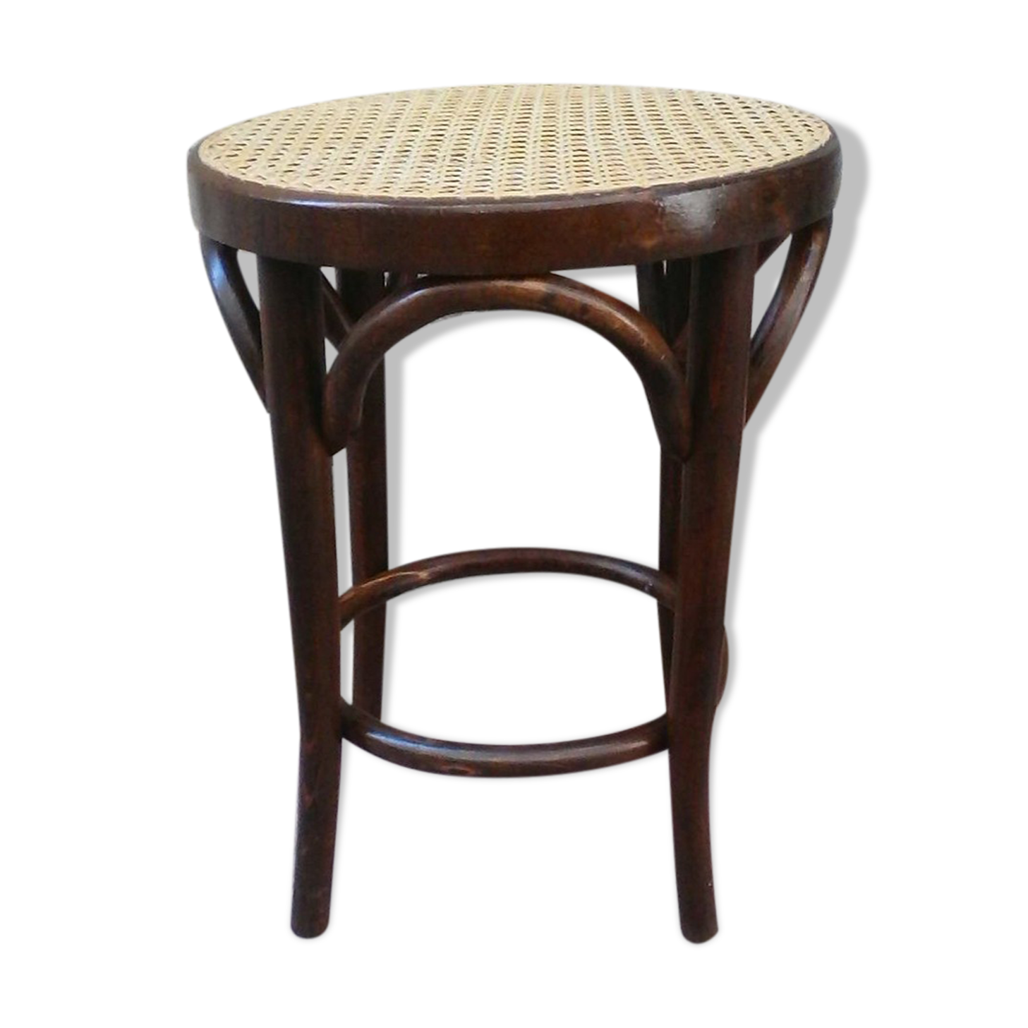 Low stool with canned seat and curved wood