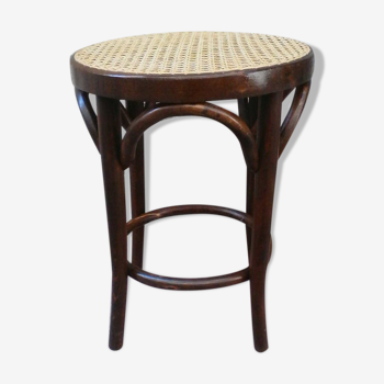 Low stool with canned seat and curved wood