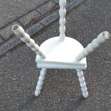 Duo of milking stools with turned legs.
