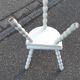 Duo of milking stools with turned legs.