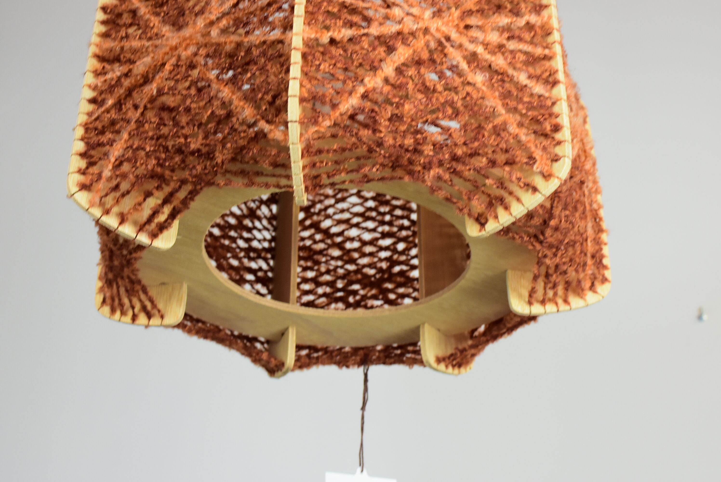 Brown wire and wood pendant light.