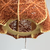 Brown wire and wood pendant light.