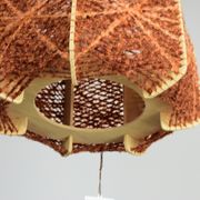 Brown wire and wood pendant light.