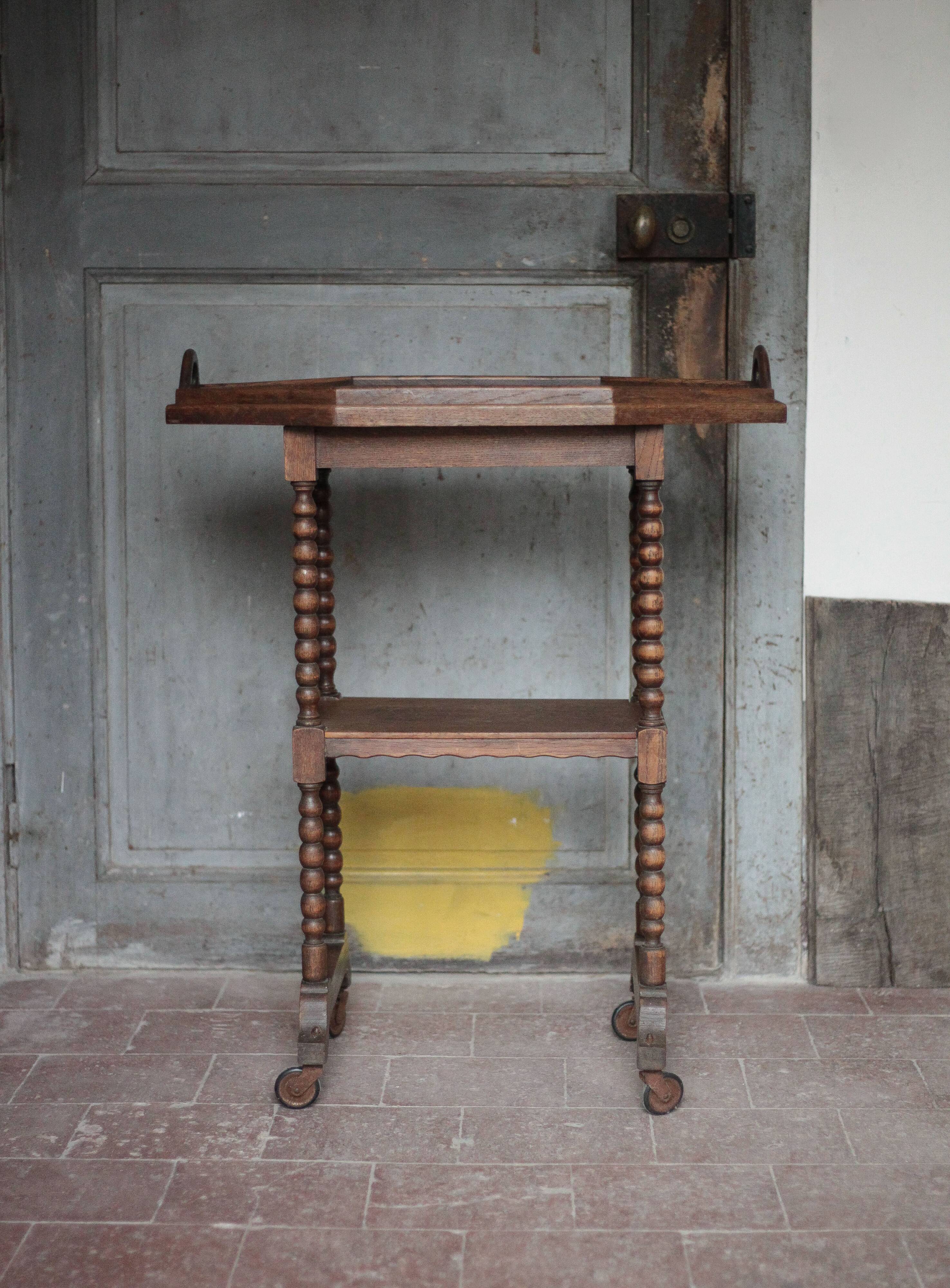 Vintage turned wood dessert trolley, wheeled table with removable top.