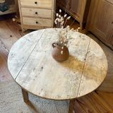 Antique round coffee table in raw solid wood