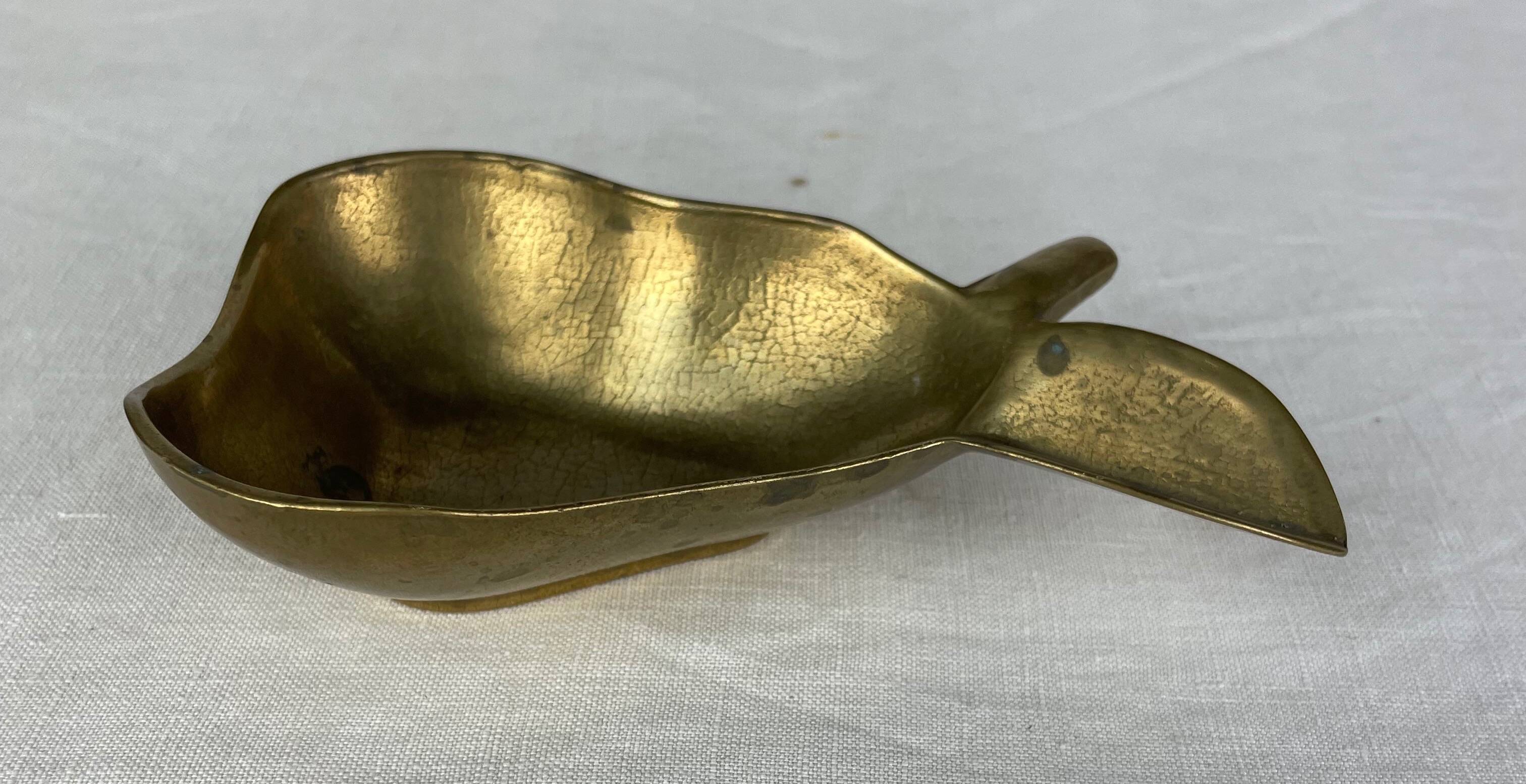 Empty pocket ashtray in pear-shaped brass