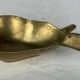 Empty pocket ashtray in pear-shaped brass