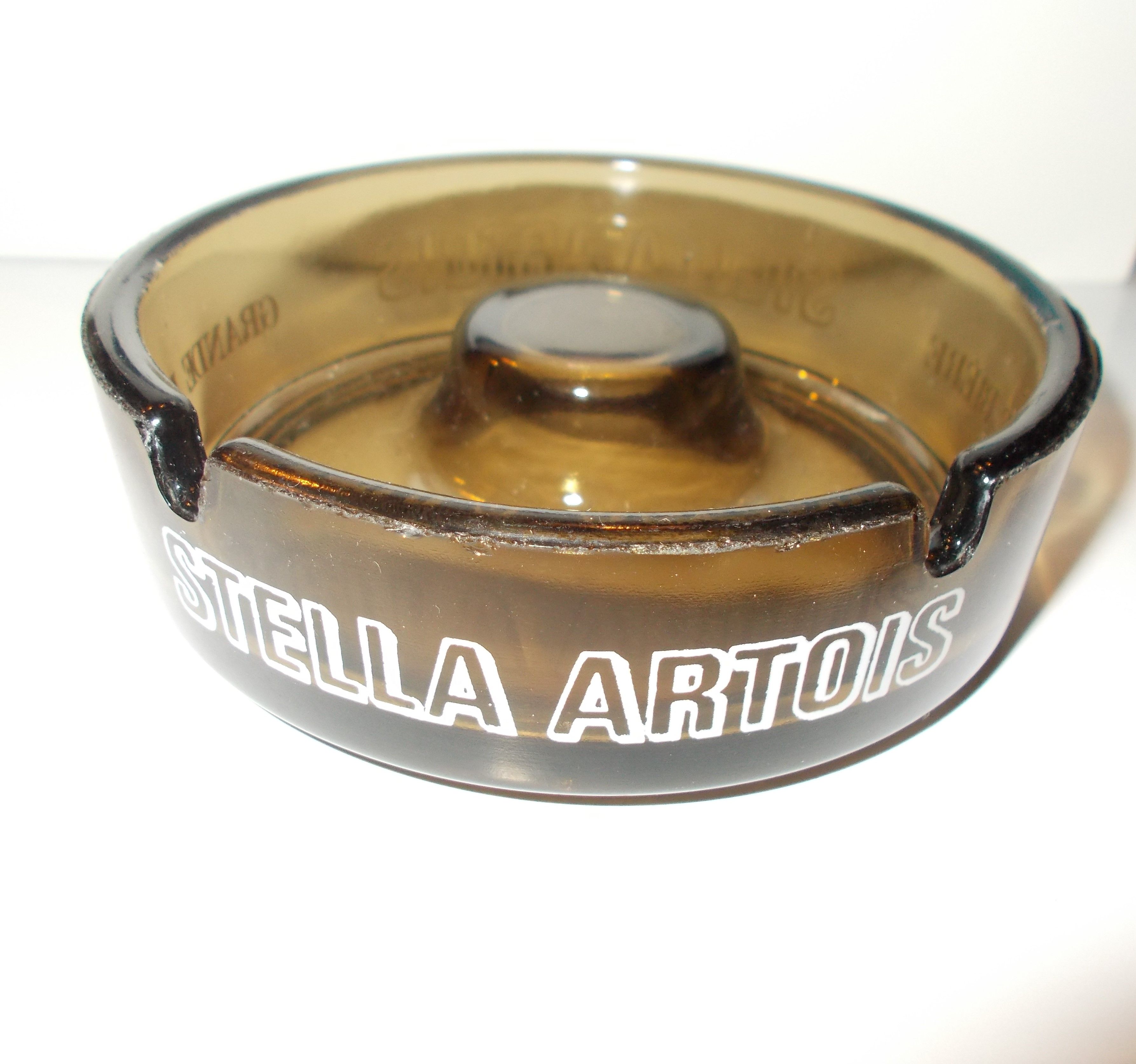 Stella Artois advertising ashtray in smoked glass color