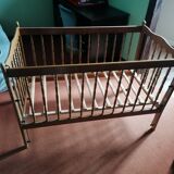 Wooden children's bed with sliding partition.