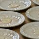 Vintage earthenware plates with a trompe l'oeil apple tart design