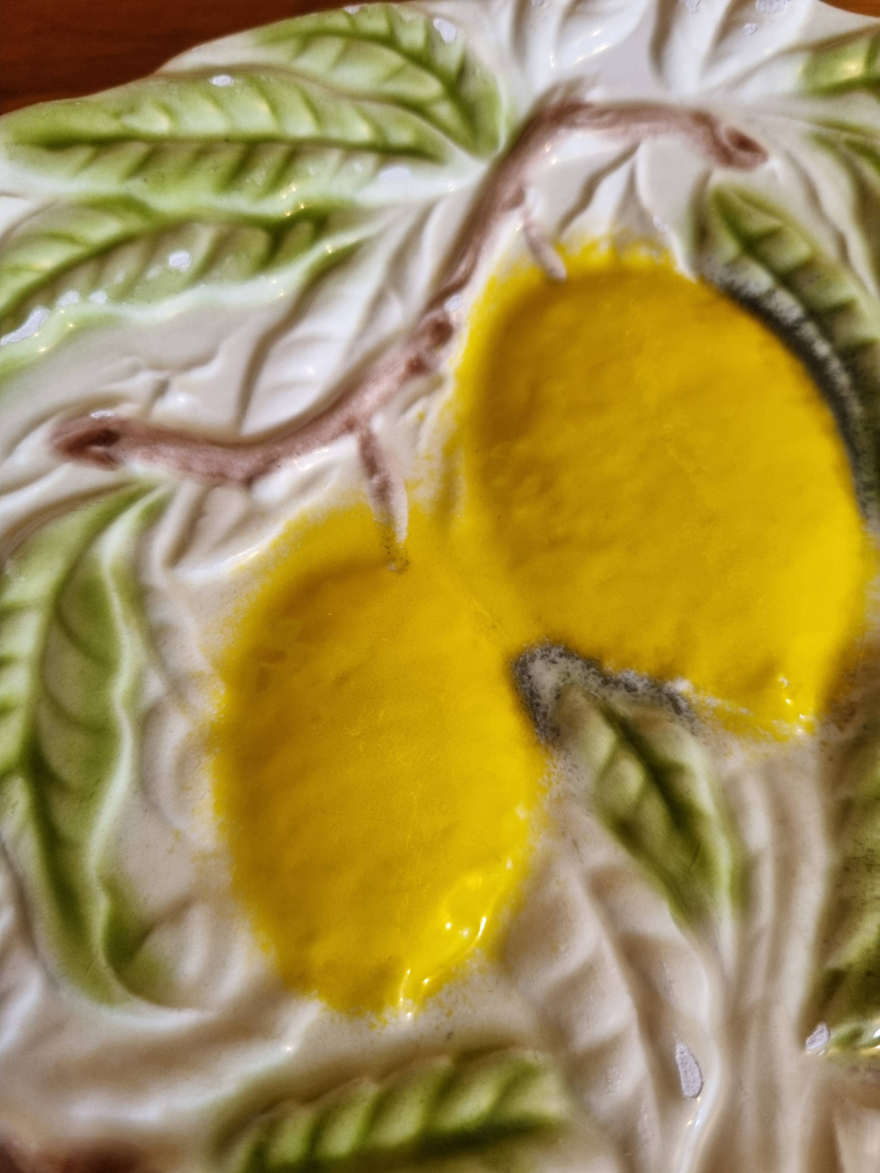 Large vintage earthenware dish with a fruit pattern.