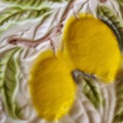 Large vintage earthenware dish with a fruit pattern.