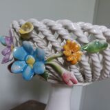 Cup on woven ceramic base with slip flowers