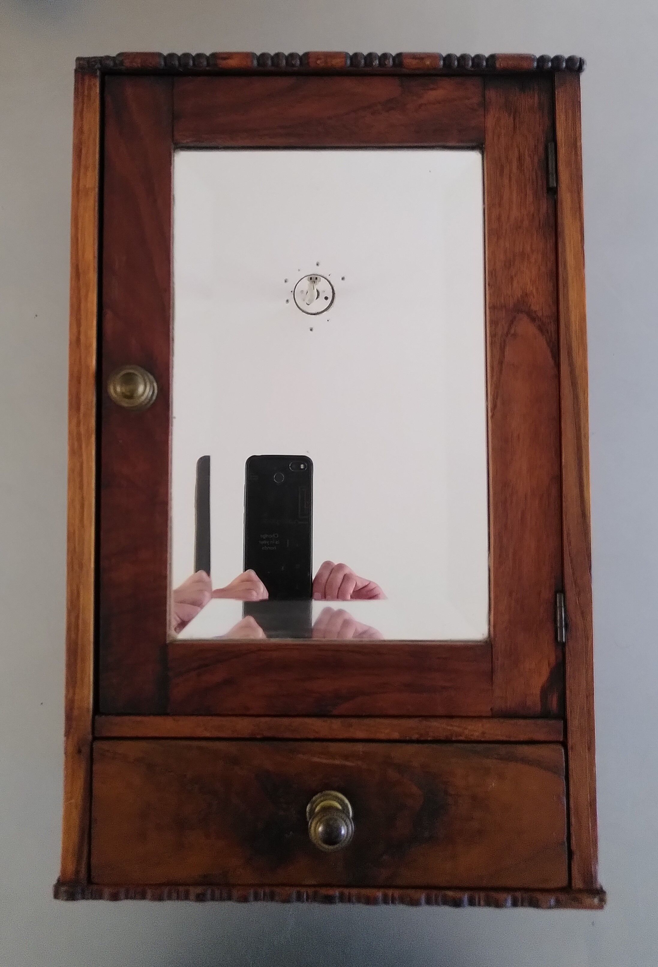 Medicine cabinet with beveled mirror