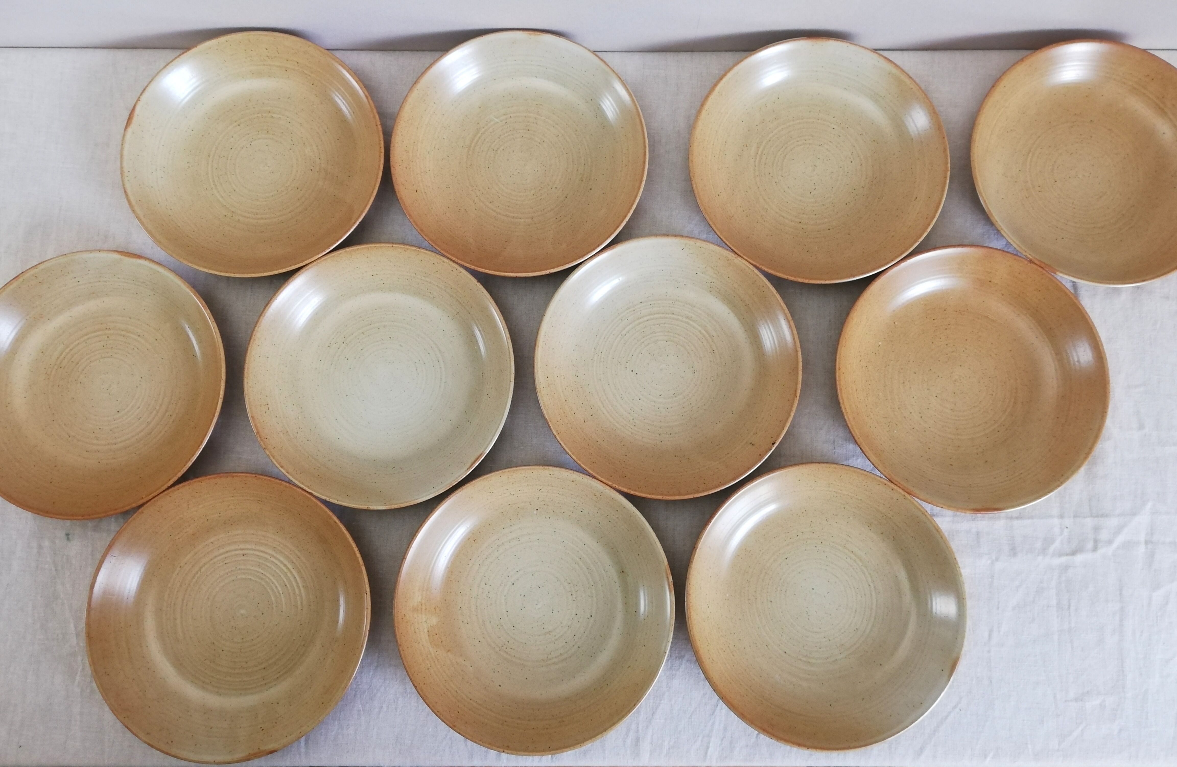 Series of 11 hollow plates Grès Village CNP