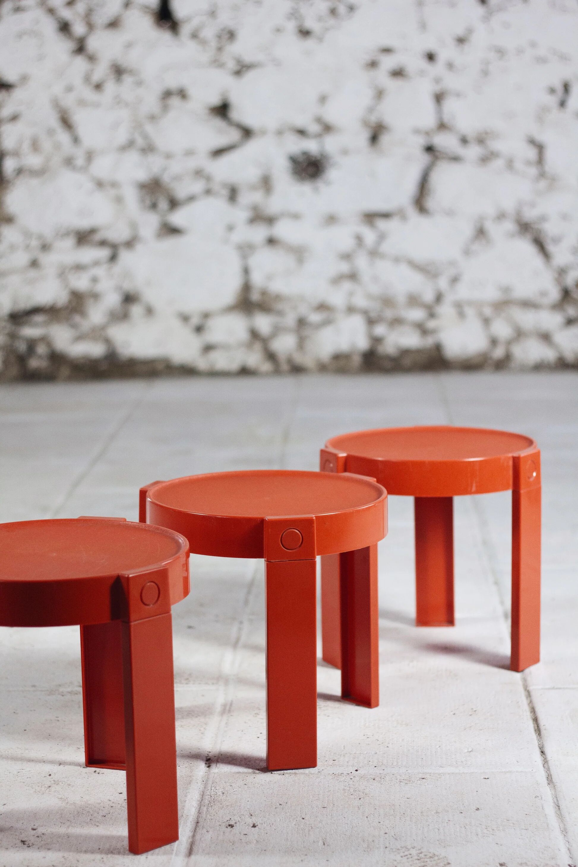 3 nesting tables in orange plastic by Prisunic, 1970.