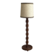 Brutalist floor lamp in turned wood, in the style of Charles Dudouyt.