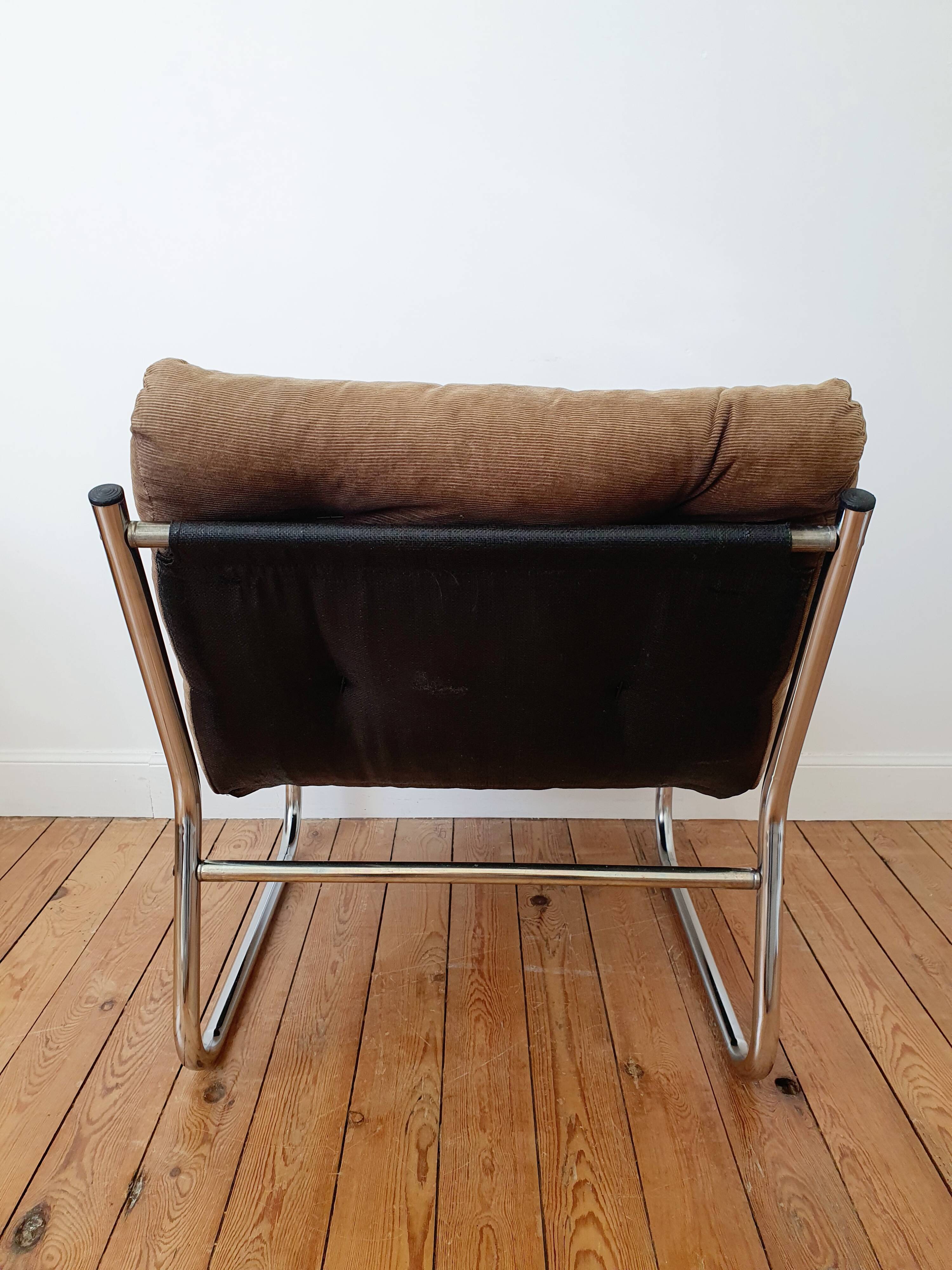 Vintage tubular chrome and velvet armchair