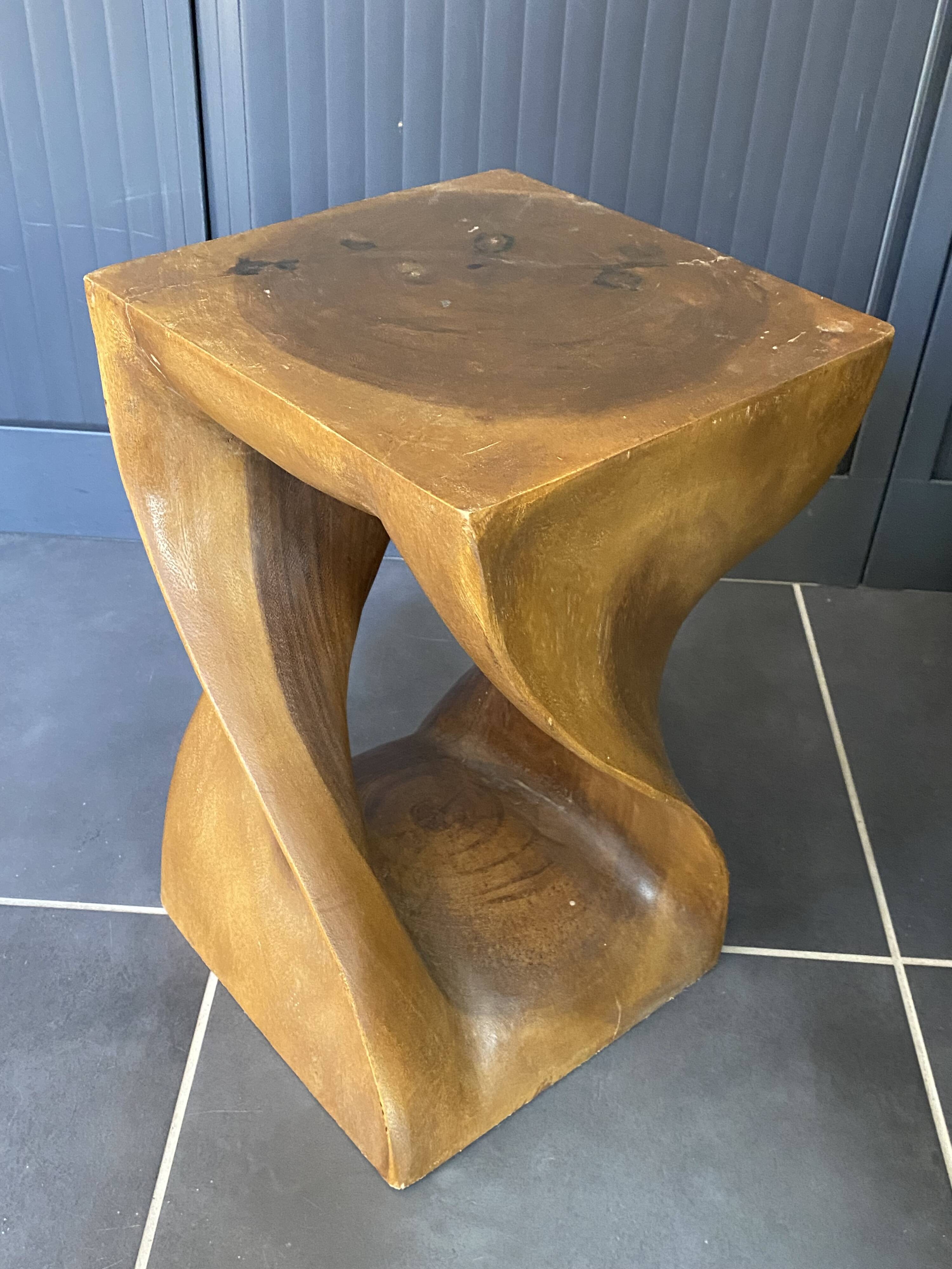 Stool n2 in solid raw walnut wood carved from the mass 1970