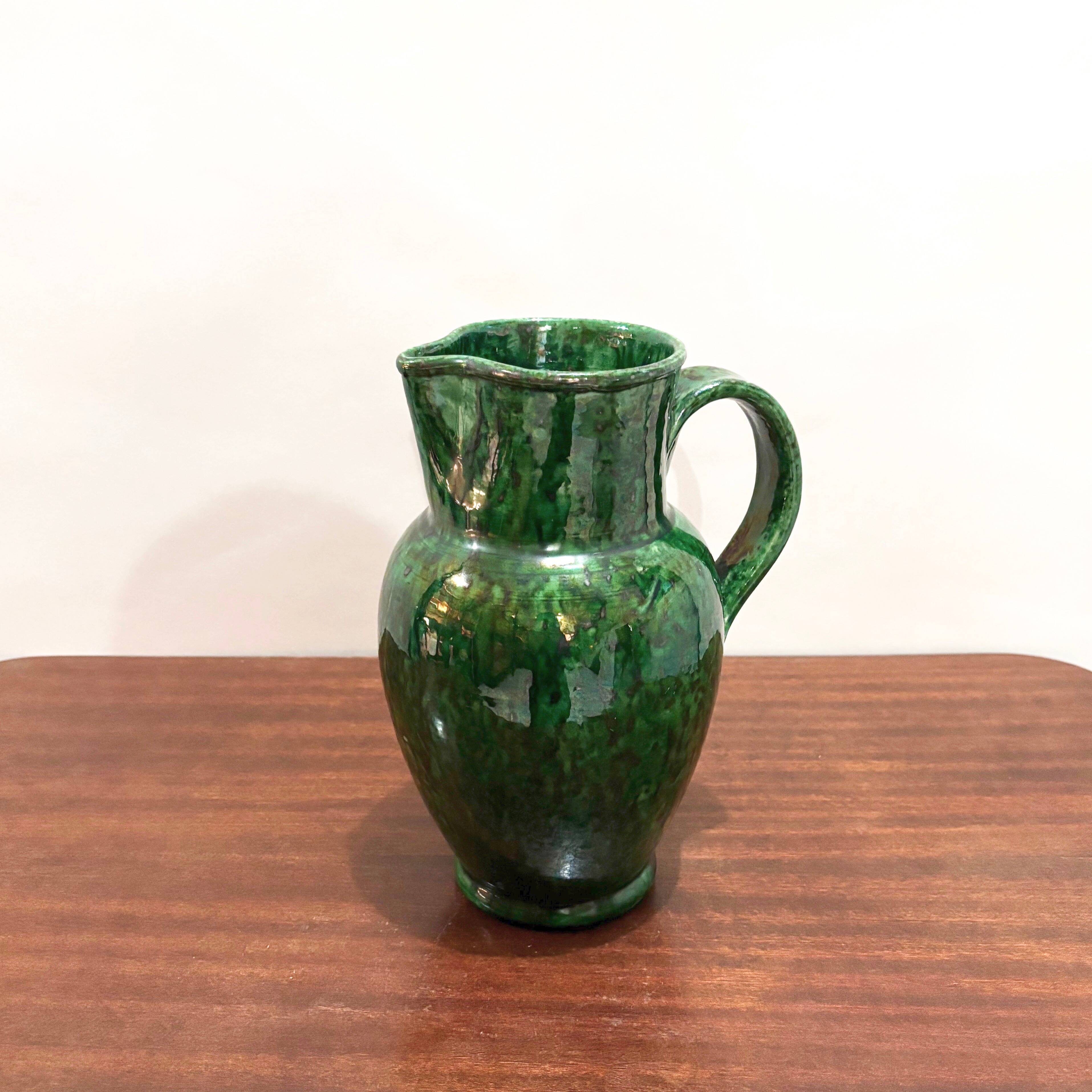 Green glazed ceramic pitcher