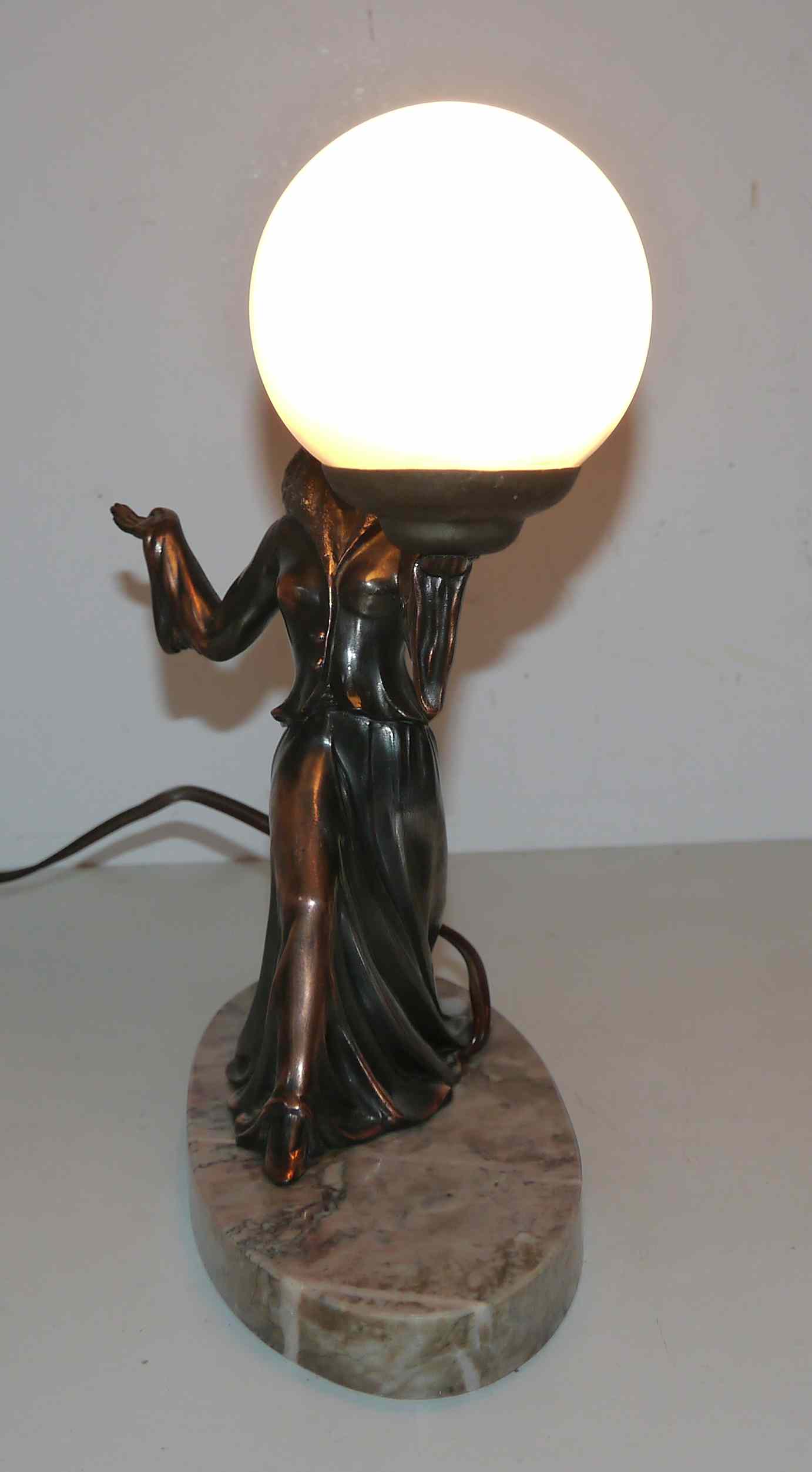Art deco lamp in regul and marble "woman holding a globe"