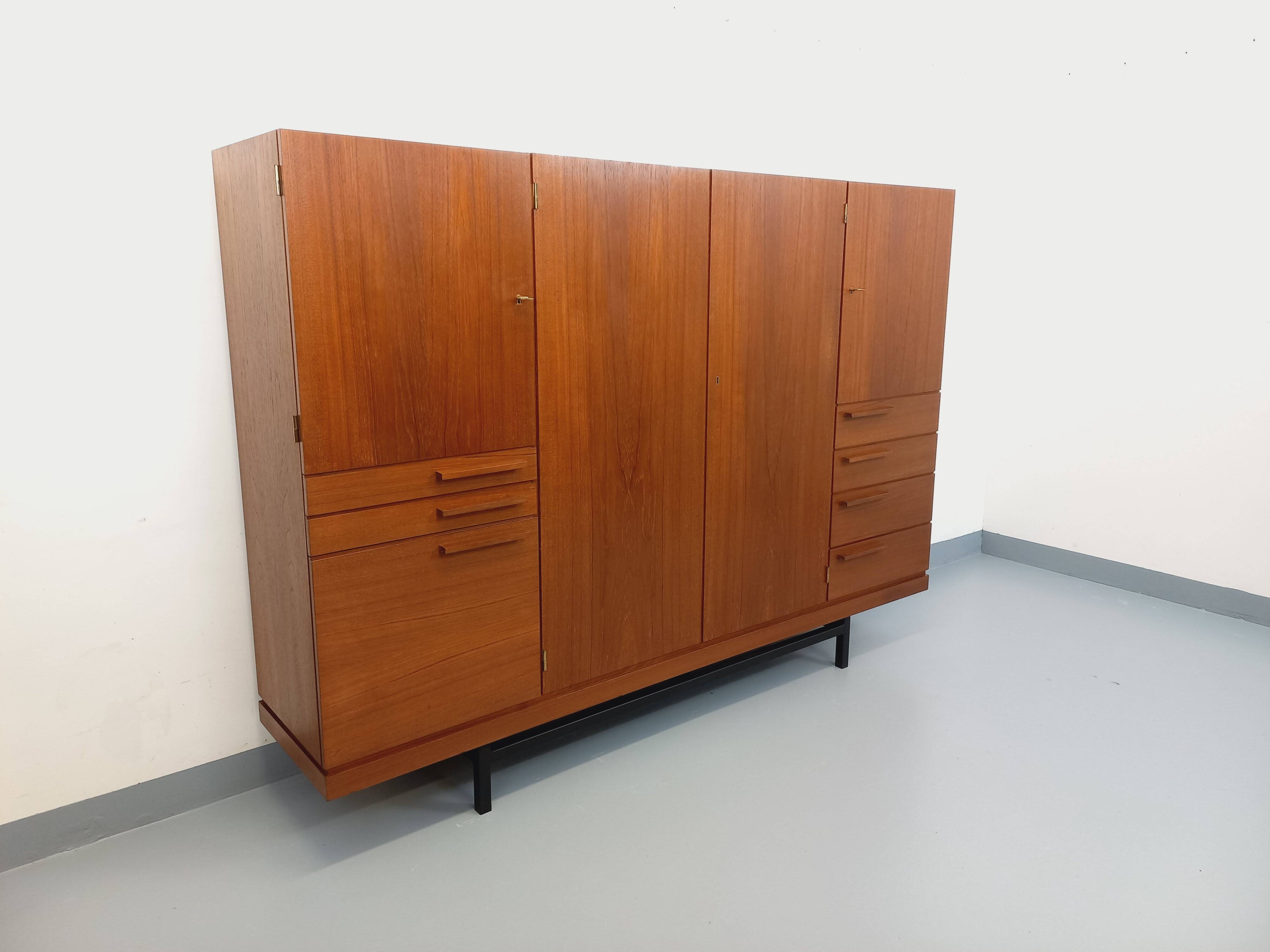High Scandinavian modernist vintage sideboard in teak and black metal.