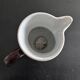 Antique tilted pitcher