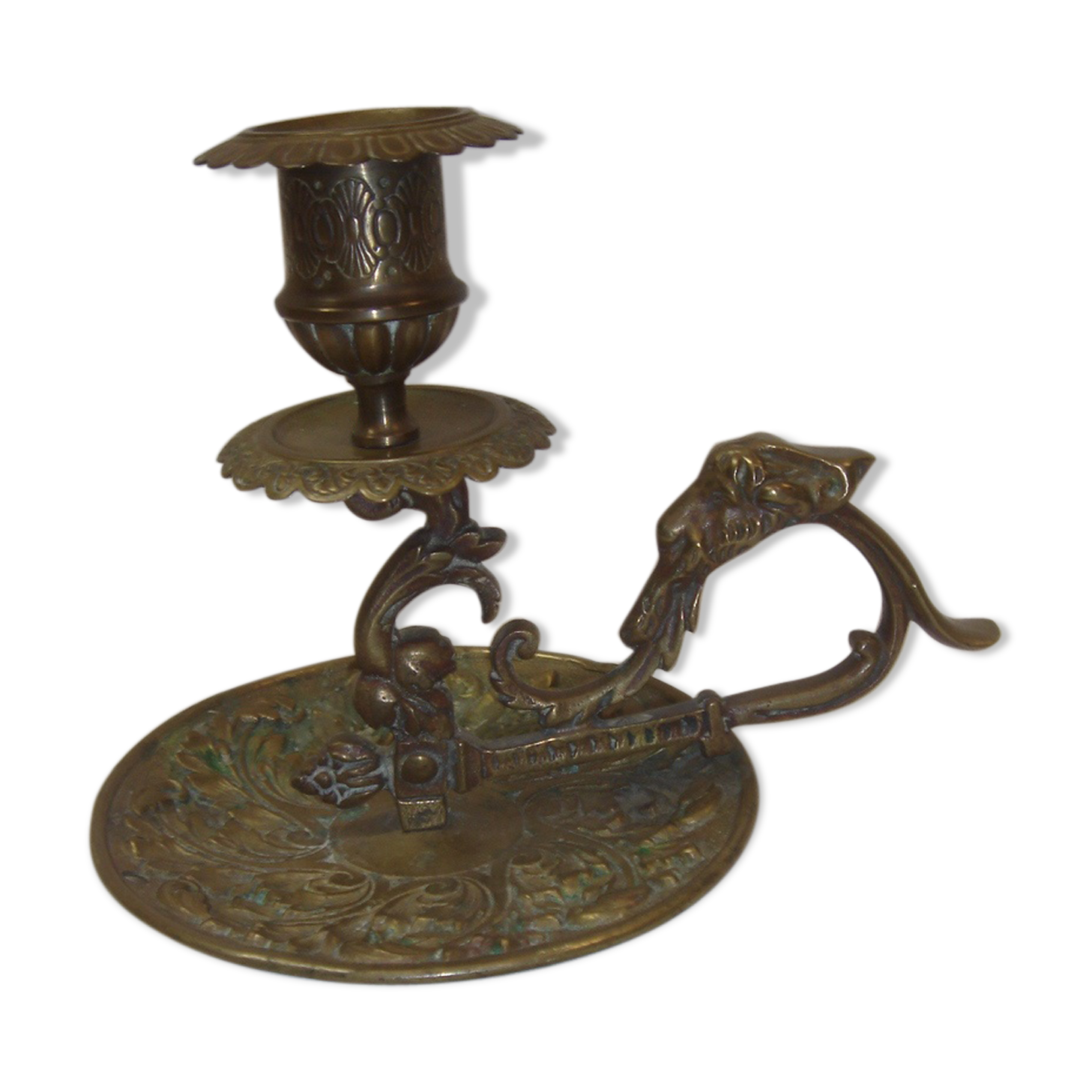 Ancient candlestick in carved bronze ram