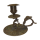 Ancient candlestick in carved bronze ram