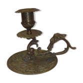 Ancient candlestick in carved bronze ram