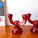 pair of burgundy enameled ceramic candlesticks / candelabras signed 1949