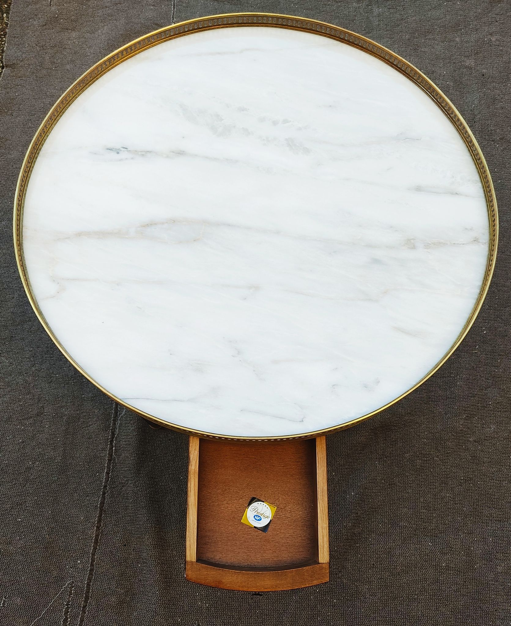 French hot water bottle table in Louis XVI style (1890); marble top and bronze gallery