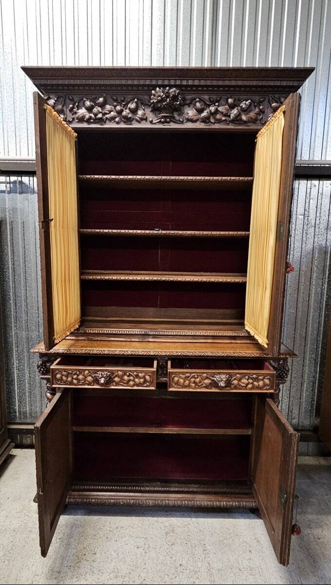Two-body buffet in solid oak, richly carved in the Renaissance style.