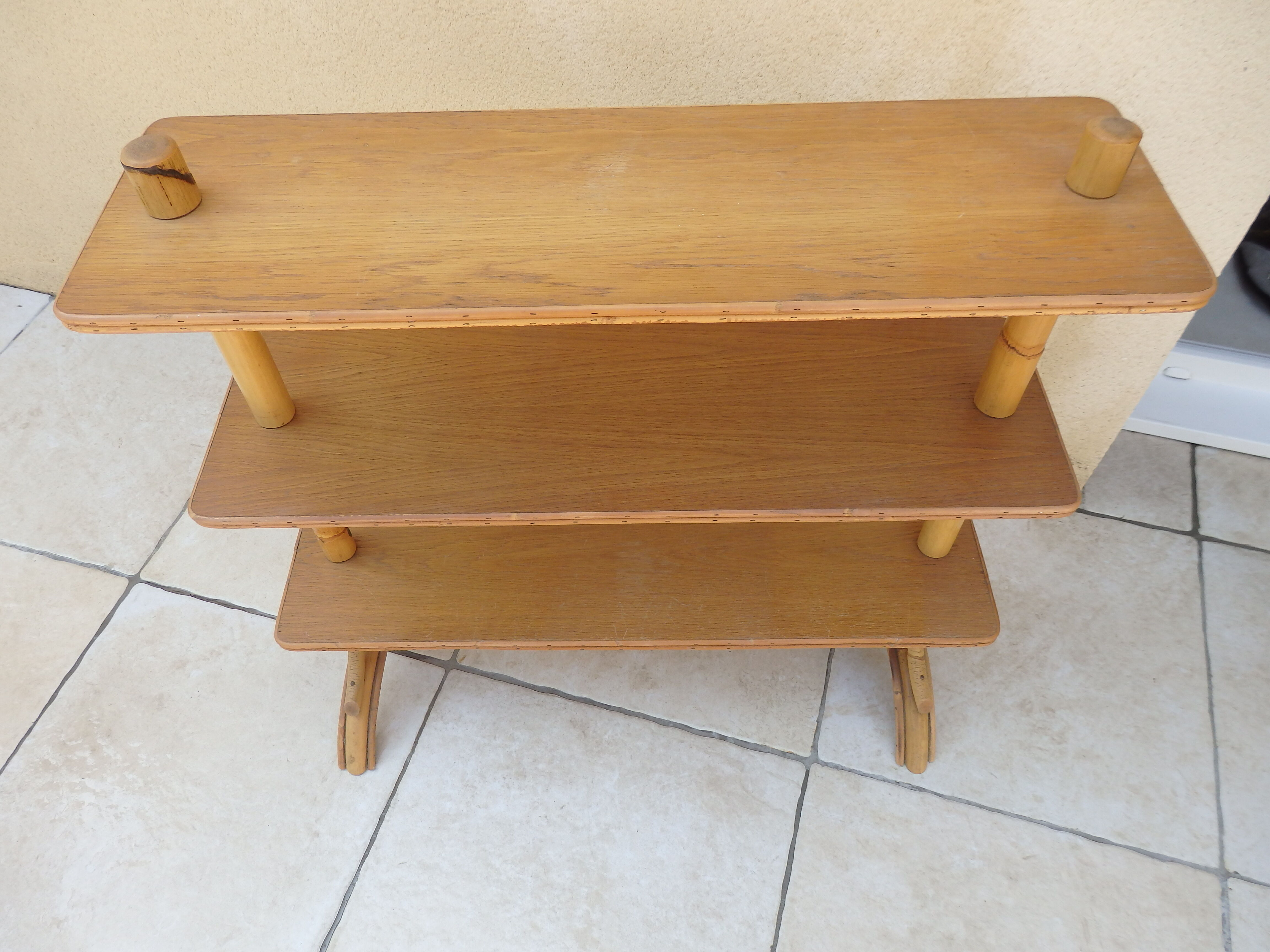 Vintage rattan shelf on feet
