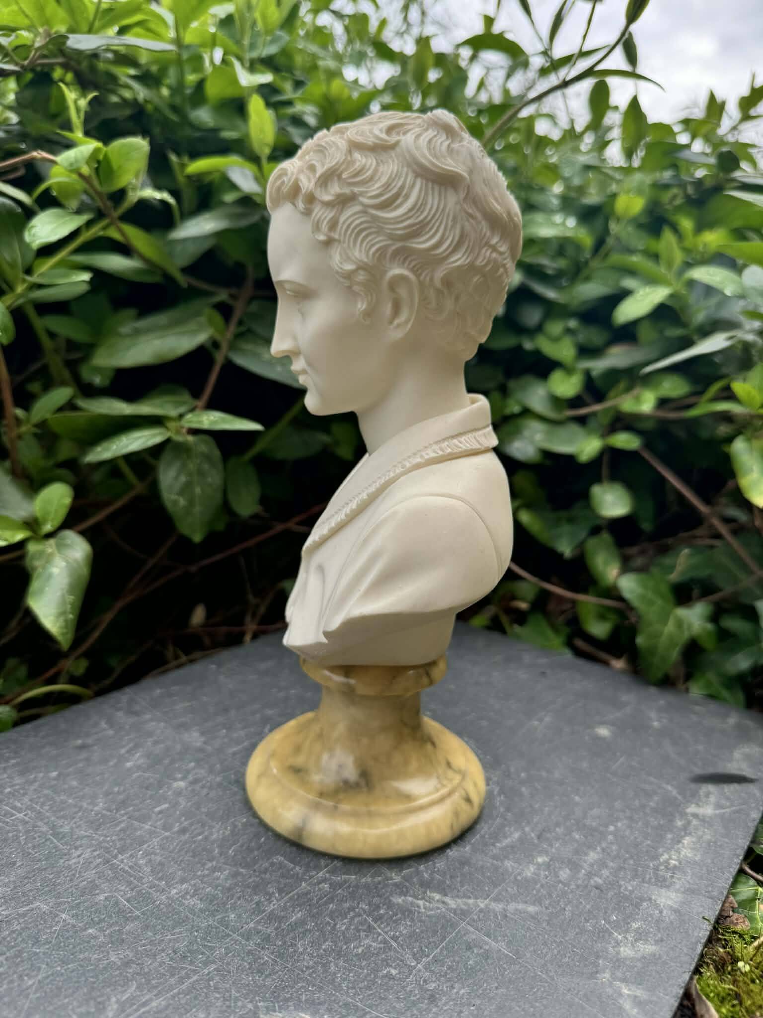 Alabaster bust of a woman signed Arnaldo Giannelli.
