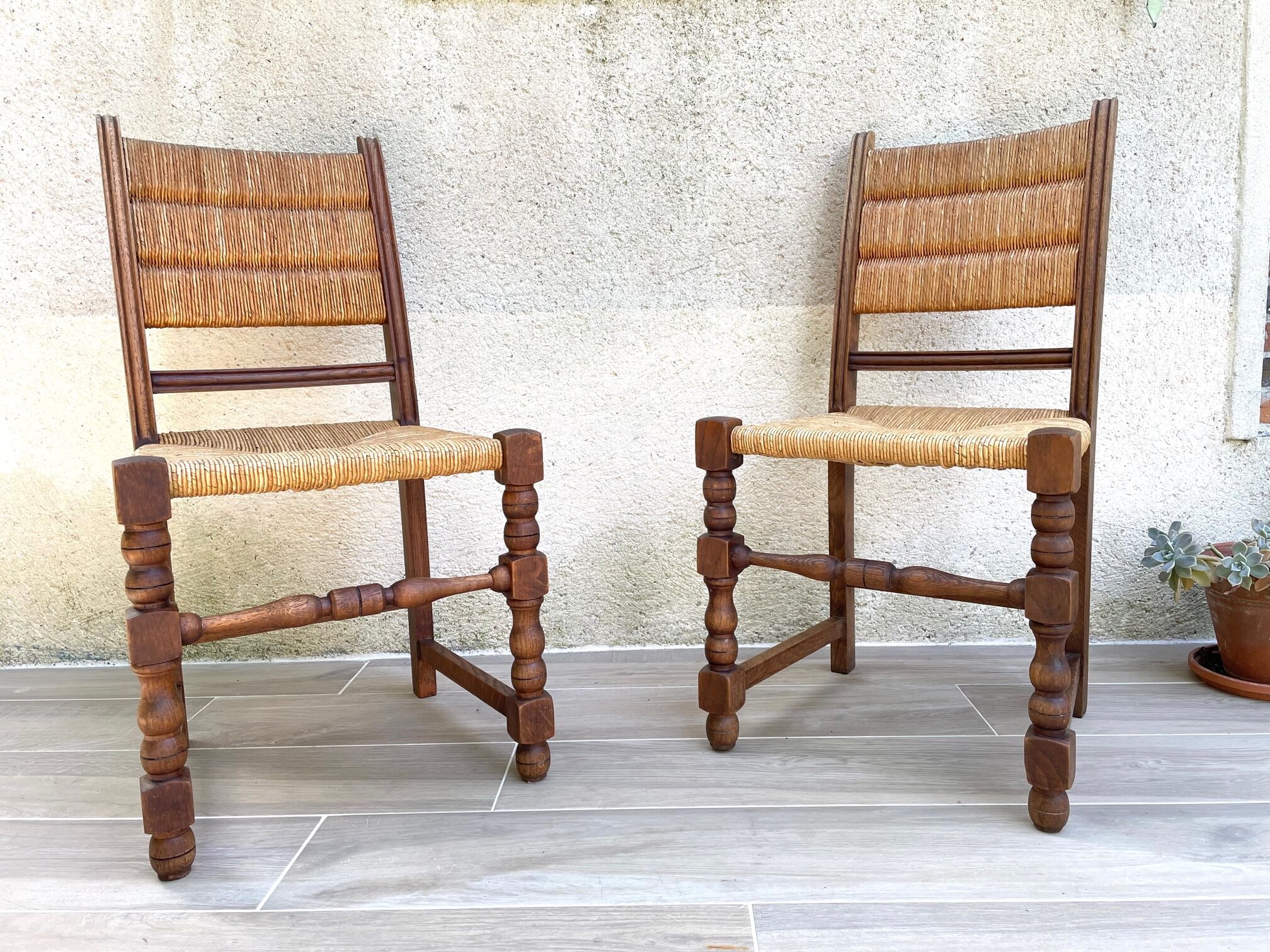Pair of straw and solid oak chairs