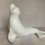 White earthenware sea lion in piggy bank