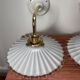 Two wall sconces in serrated white opaline