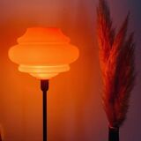 Table lamp with a vintage orange globe from an old pendant light