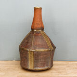 Old terracotta and brass bottle