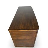A vintage Italian chest of drawers, made of veneered walnut and solid wood,
