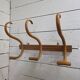 Curved wooden coat rack with 3 hooks, 1920s.